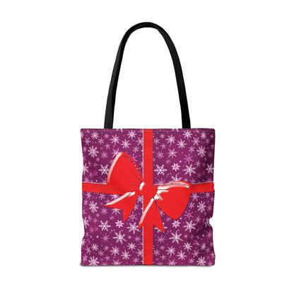 Purple tote bag with black handles featuring white snowflakes and a red bow festive pink christmas tote bag