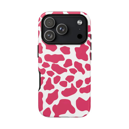 Vibrant pink cow print phone case with white accents featuring a sleek protective design showing the back side