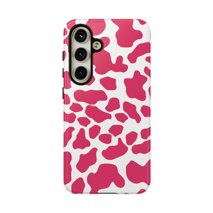 Back view of a pink cow print phone case cover with cute tough cases protection and white spots design