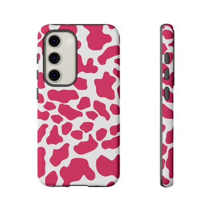 Pink cow print phone case cover in pink and white showing the back side for cute tough case protection
