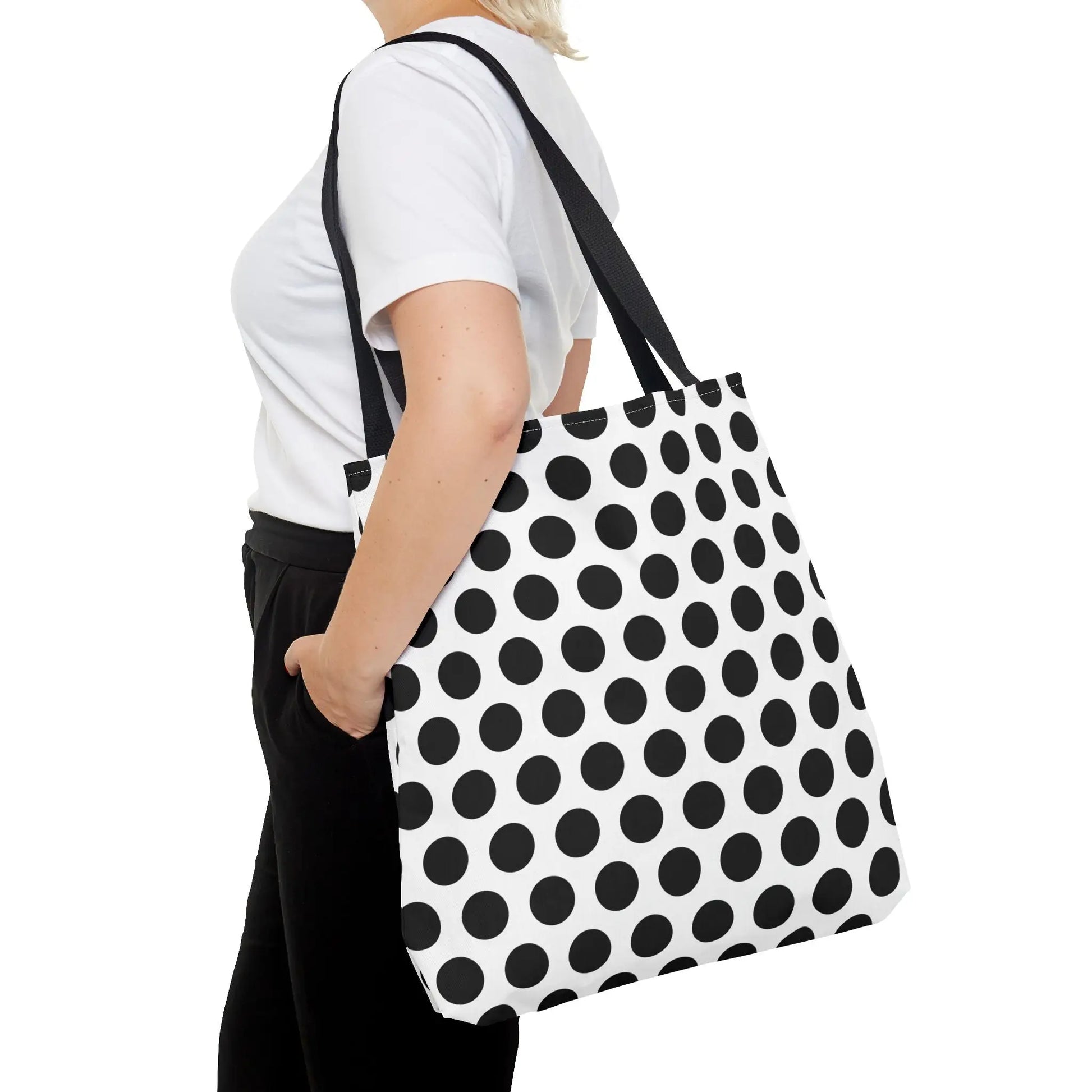 Black and white polka dot tote bag with black shoulder straps made of canvas reusable and eco friendly shopping bag