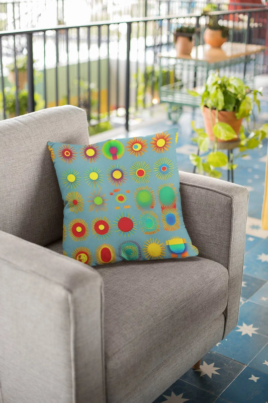 Sun design square soft pillow with colorful sunburst pattern in red yellow green and orange on light blue background
