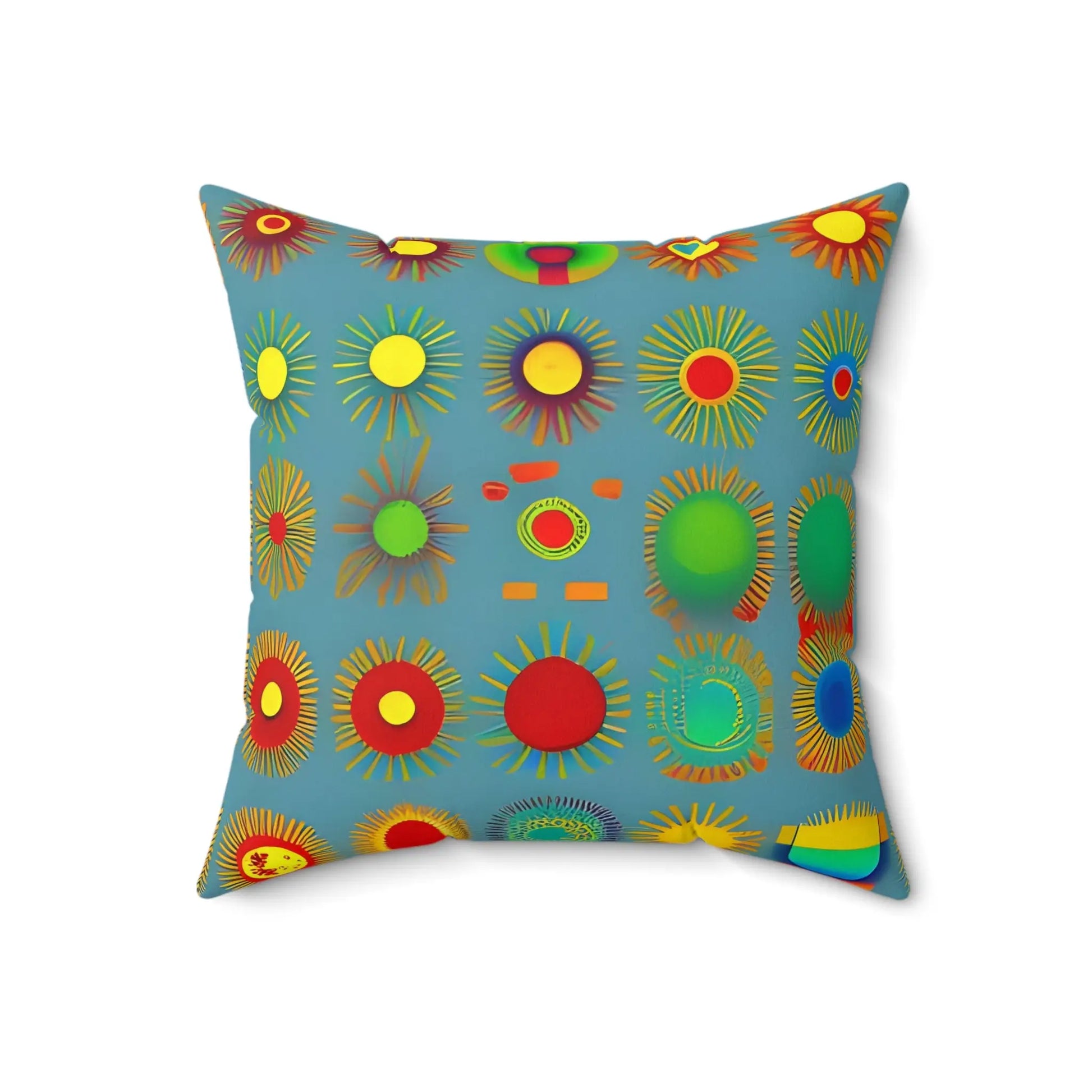 A sun design square soft pillow with colorful sunburst patterns in red yellow green and blue on a light teal background