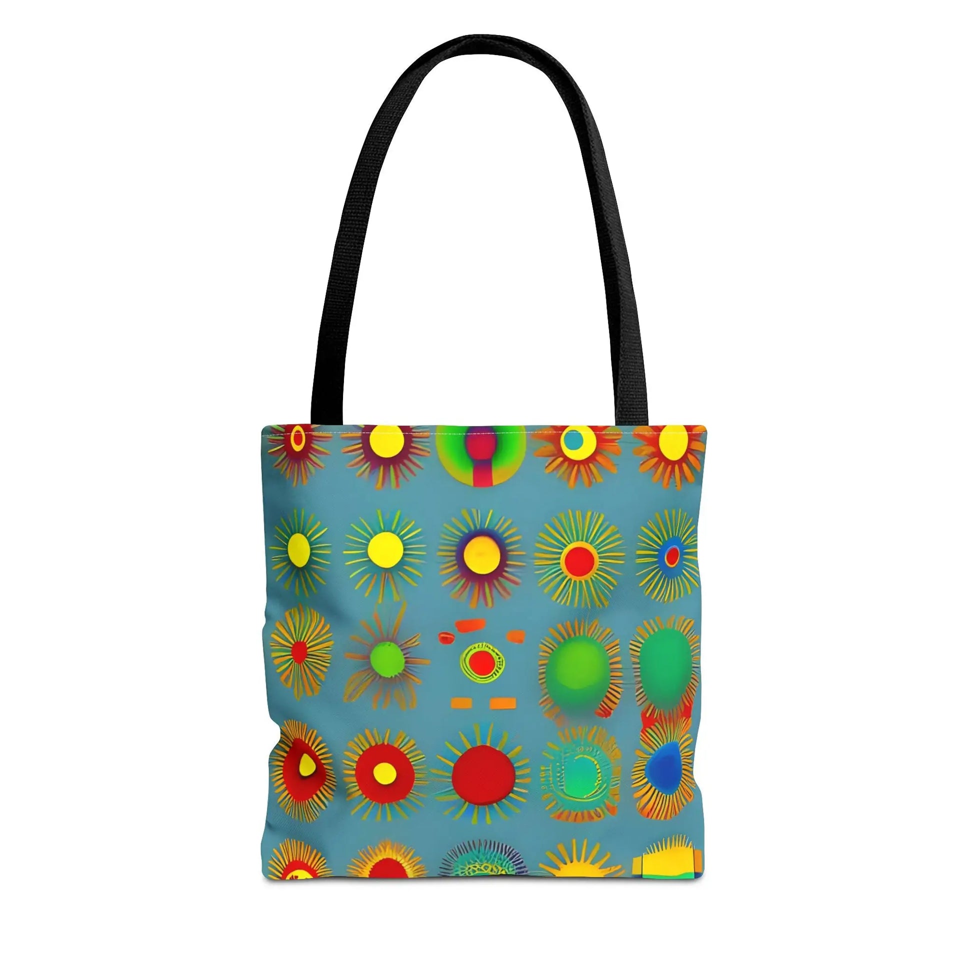 Sun pattern tote bag with black handles and blue fabric featuring colorful abstract sunburst patterns