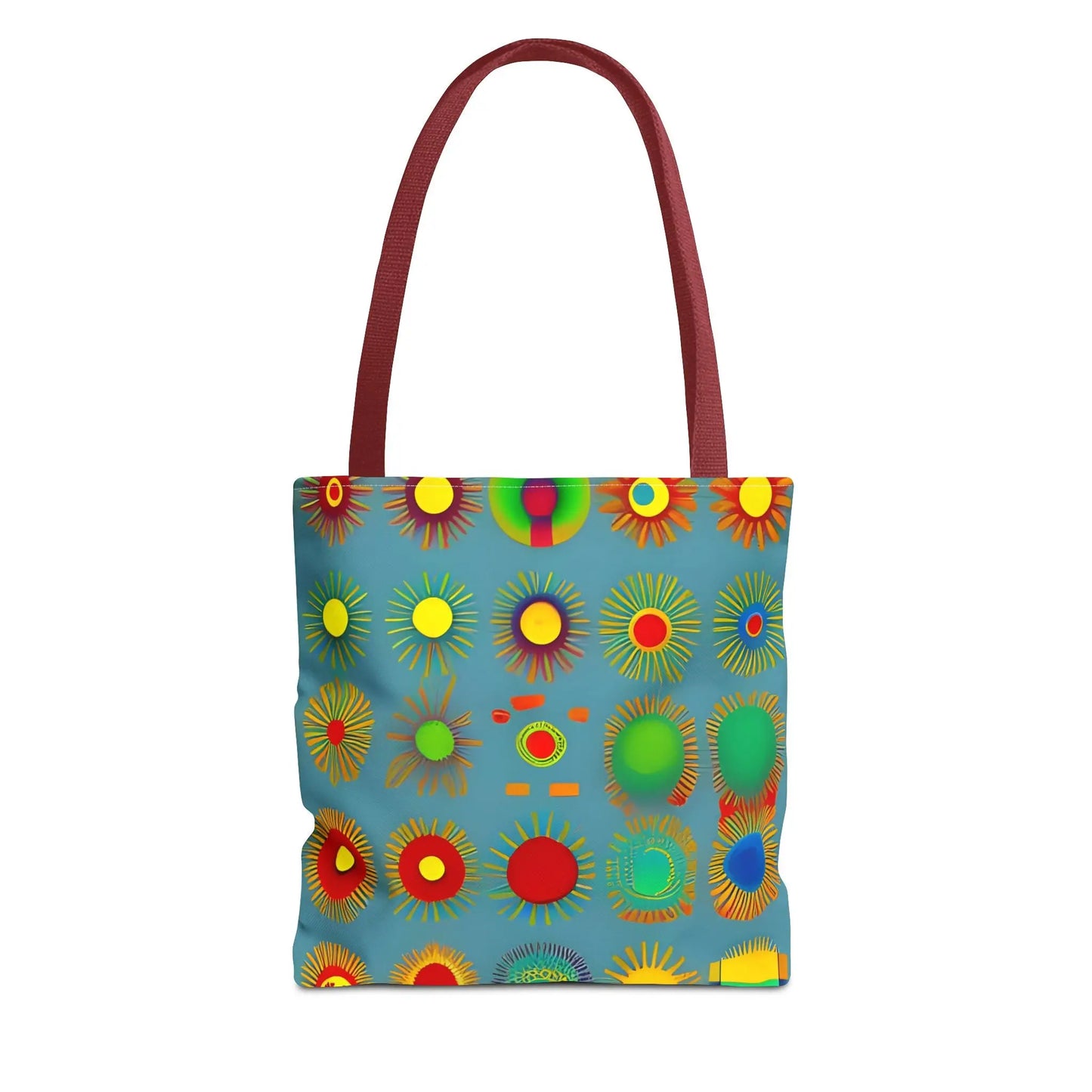 A vibrant blue sun pattern tote bag with colorful sunburst circles and contrasting maroon handles
