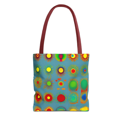 A vibrant blue sun pattern tote bag with colorful sunburst circles and contrasting maroon handles