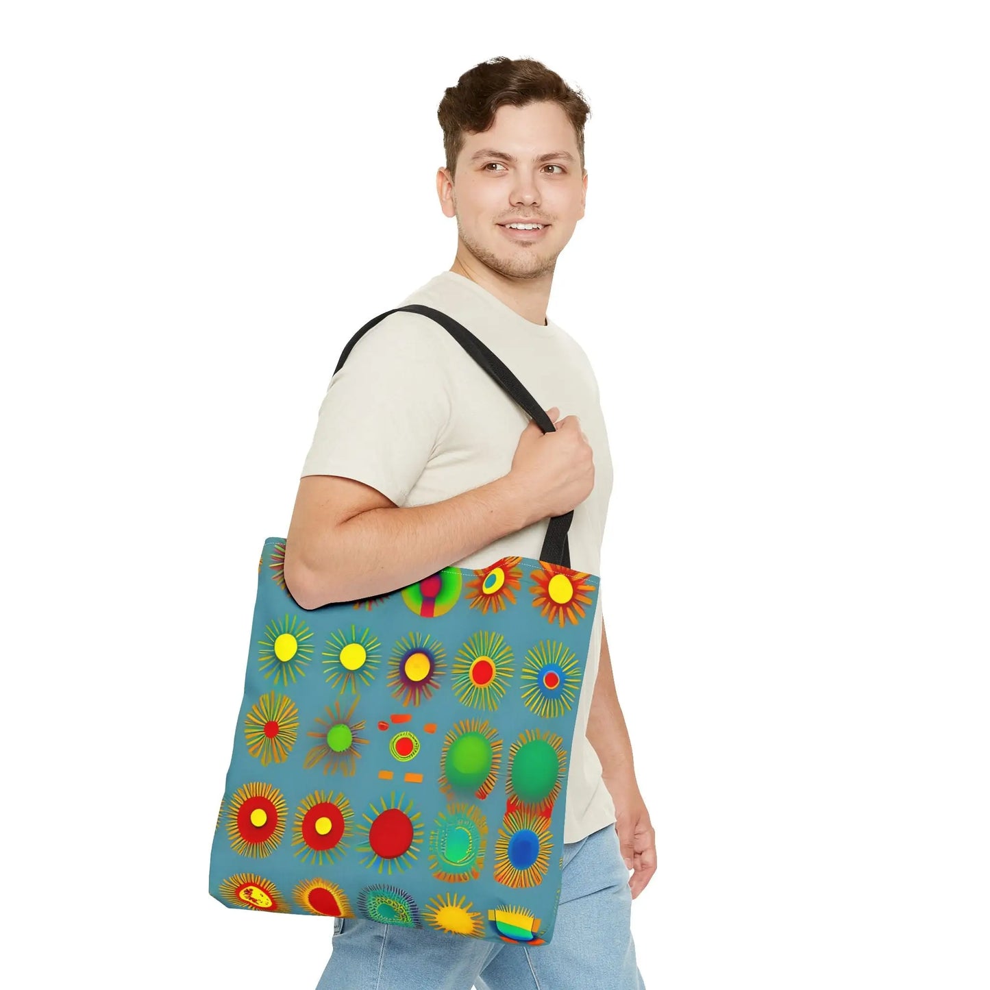Blue canvas sun pattern tote bag featuring colorful abstract sunburst patterns in red yellow green and blue