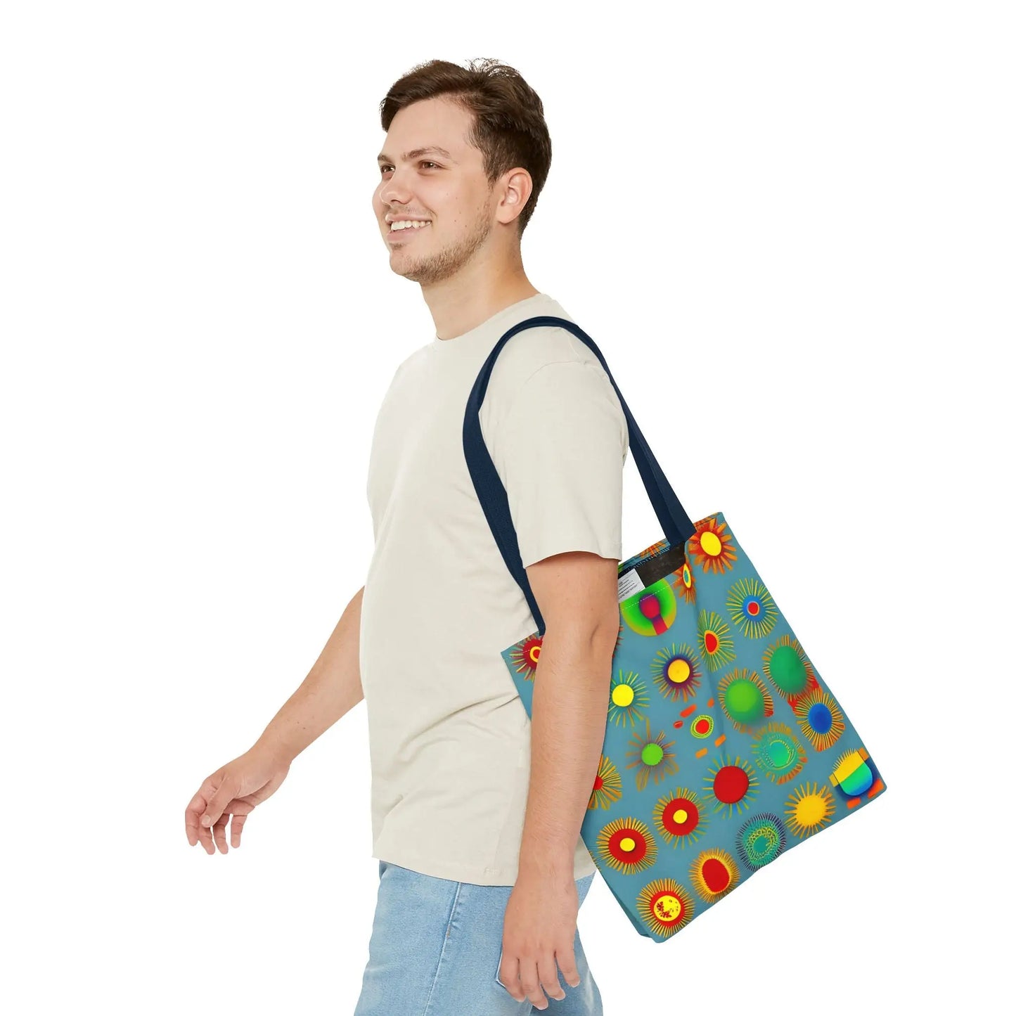 Blue canvas sun pattern tote bag featuring vibrant red yellow green and orange stylized suns and circles pattern tote bag