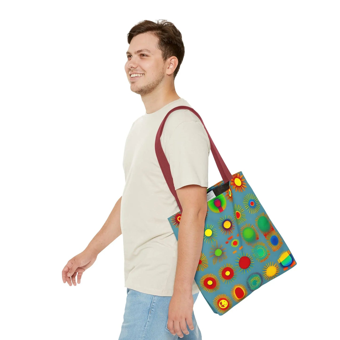 Blue canvas sun pattern tote bag with vibrant colorful circular sunburst patterns in red yellow green and orange
