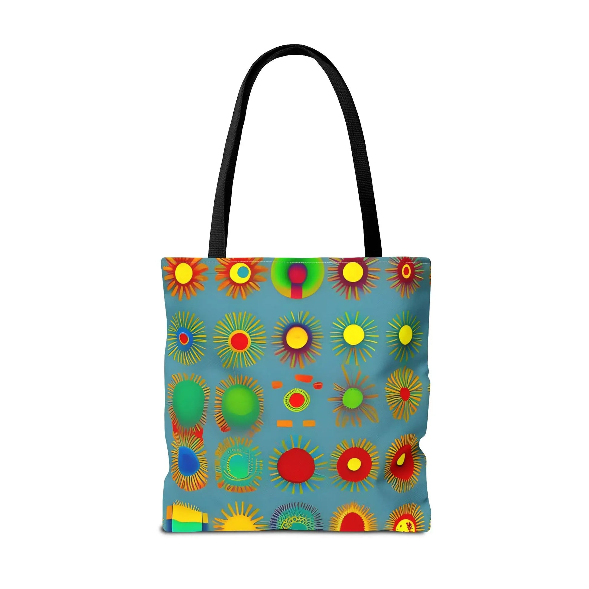 A vibrant sun pattern tote bag with black handles and colorful sunburst circular patterns on a blue background