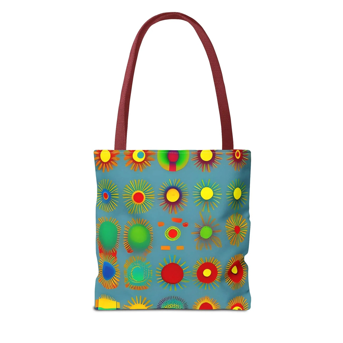 A vibrant blue sun pattern tote bag with bold red yellow green and orange sunburst patterns on a light teal background