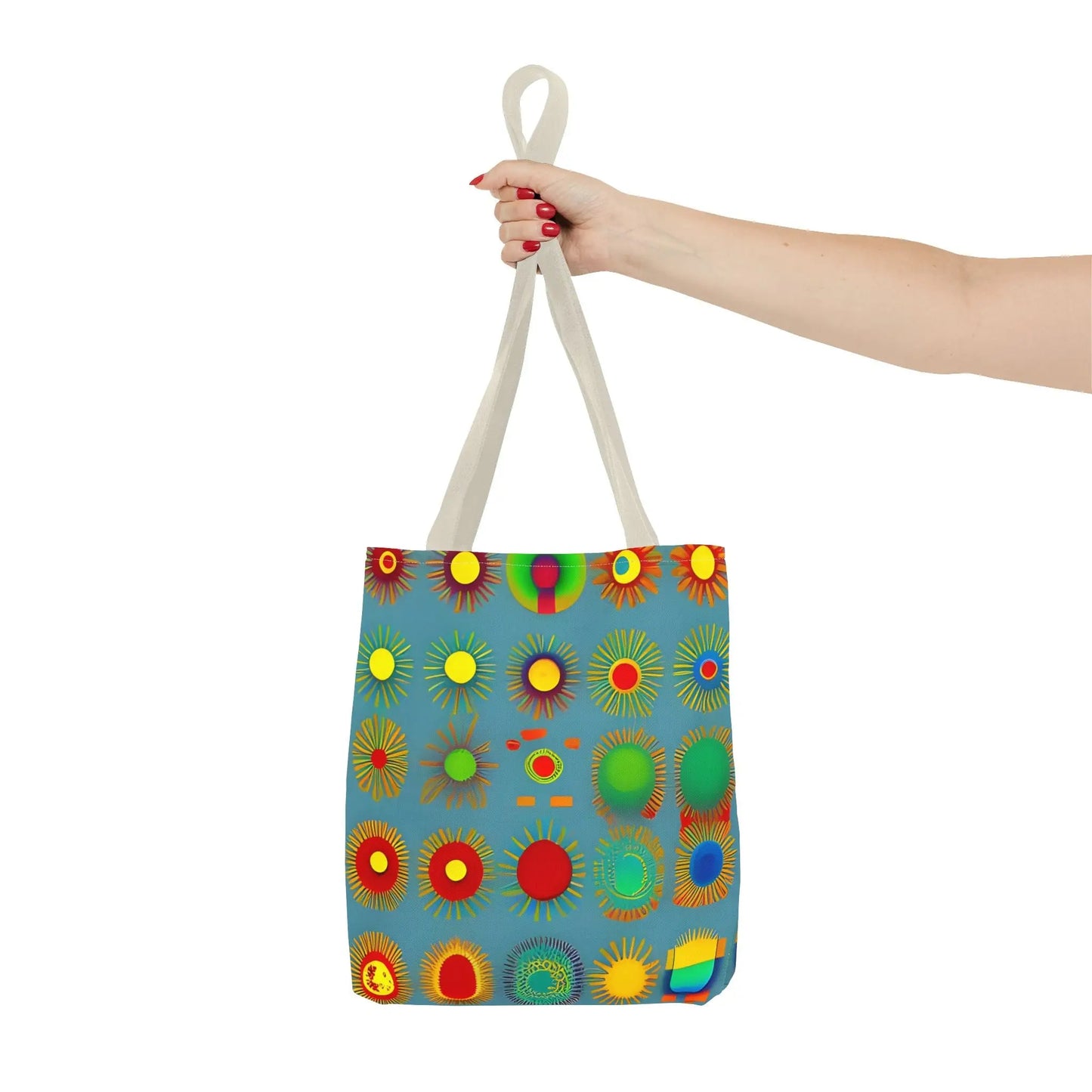 A vibrant blue canvas sun pattern tote bag with colorful red yellow green and orange stylized sunburst designs