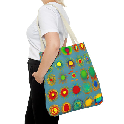 A vibrant blue canvas sun pattern tote bag featuring colorful sunburst circles in red yellow green and orange