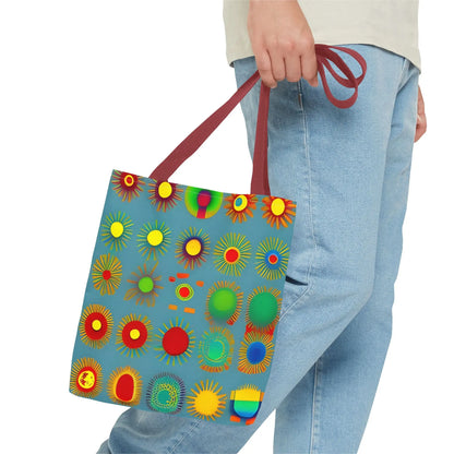 A vibrant blue canvas sun pattern tote bag with colorful sunburst circles in red yellow green and orange