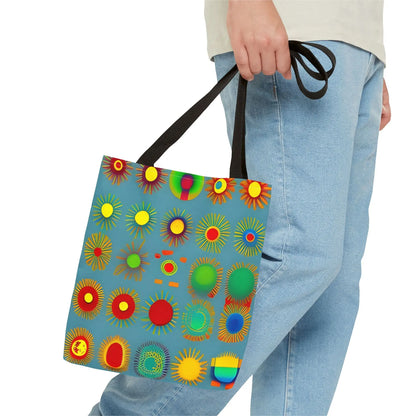 A vibrant blue sun pattern tote bag with colorful sunburst circles and black handles perfect for everyday use
