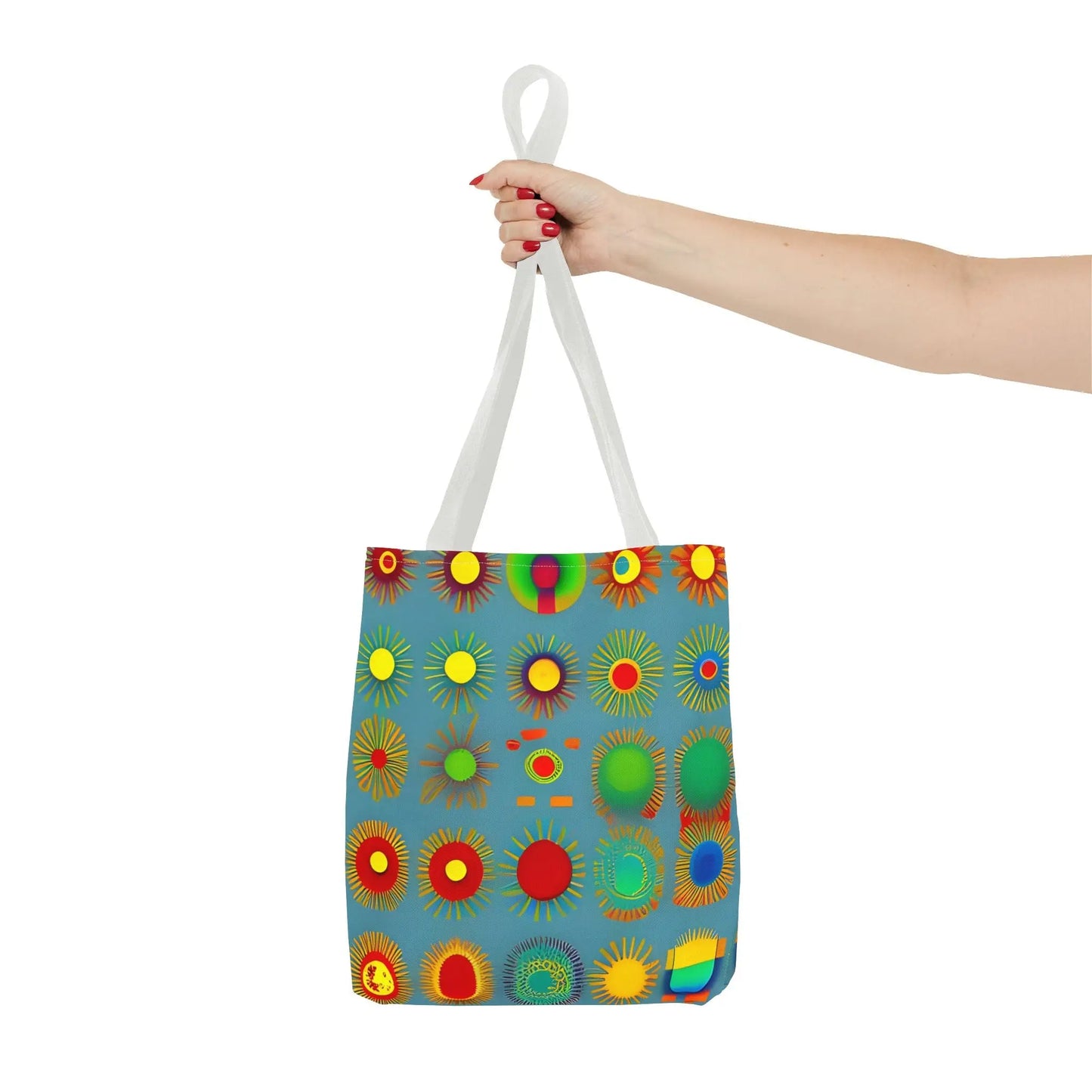 A vibrant blue sun pattern tote bag with colorful sunburst circles and white handles perfect for everyday use