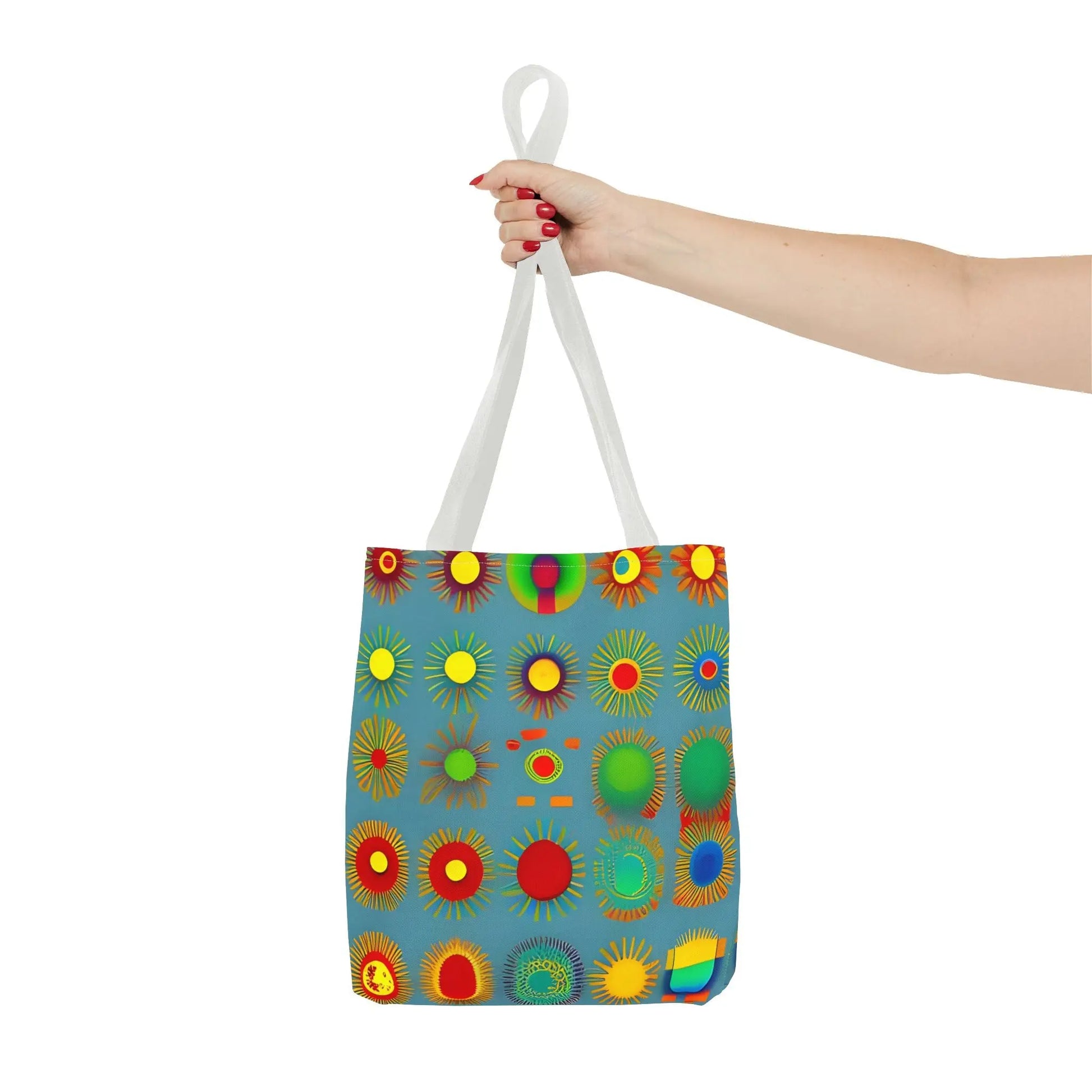 A vibrant blue sun pattern tote bag with colorful sunburst circles and white handles perfect for everyday use