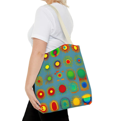 A vibrant blue sun pattern tote bag with colorful sunburst circles in red green yellow and orange on canvas material