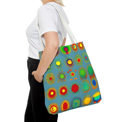 A vibrant blue canvas sun pattern tote bag with colorful sunburst circles in red yellow green and orange