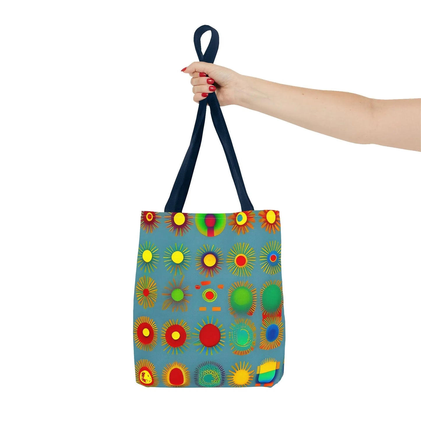A vibrant blue sun pattern tote bag featuring colorful radiating sunburst designs in red yellow green and orange