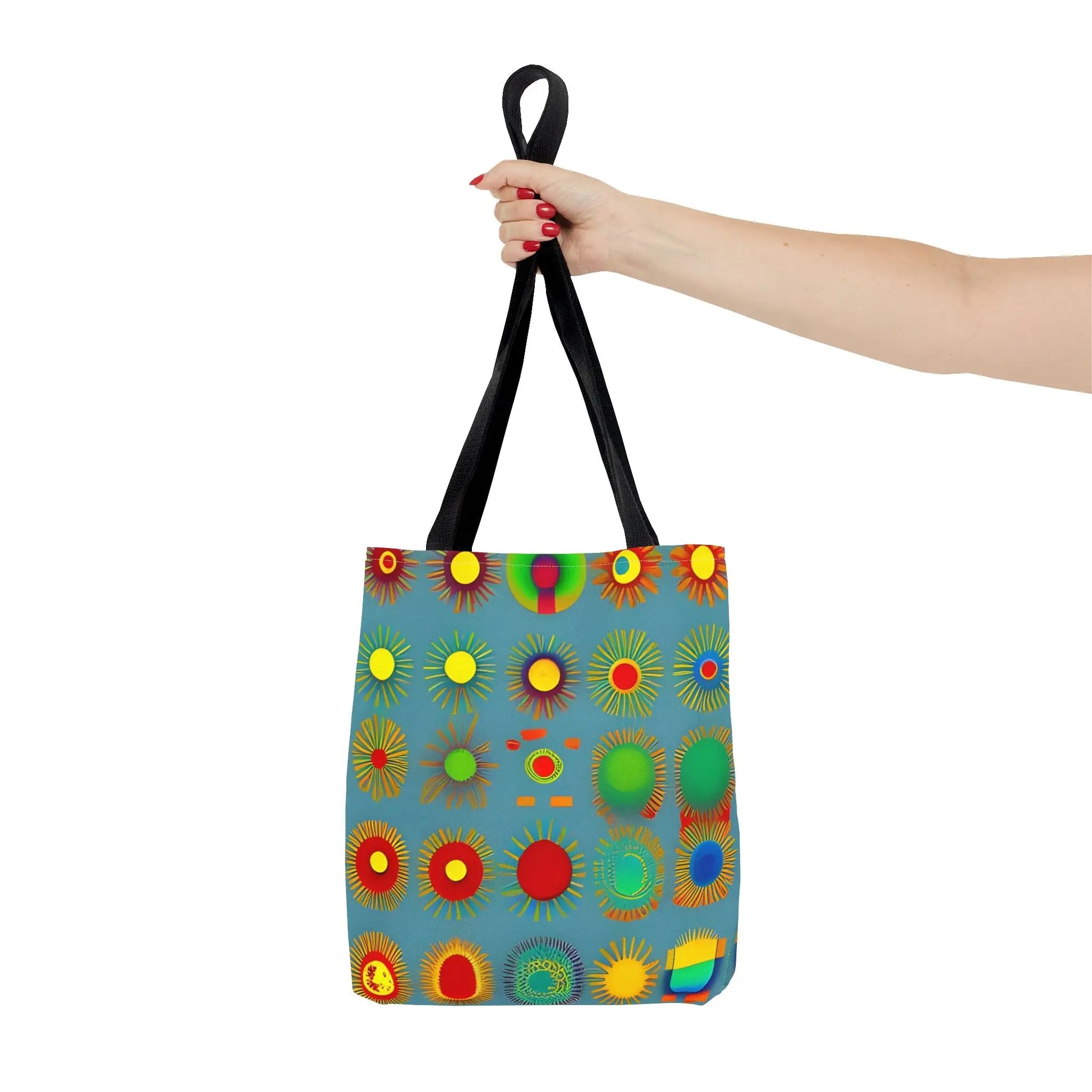 A vibrant blue sun pattern tote bag with colorful sunburst circles and black handles perfect for everyday use