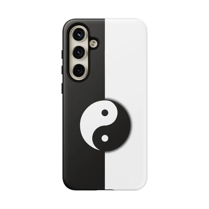 Back side of a tough yin yang black and white phone case featuring a centered yin yang symbol on a split design